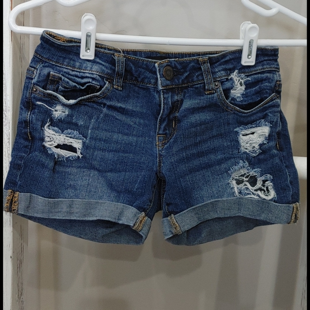 Dark wash shorts with distressing
